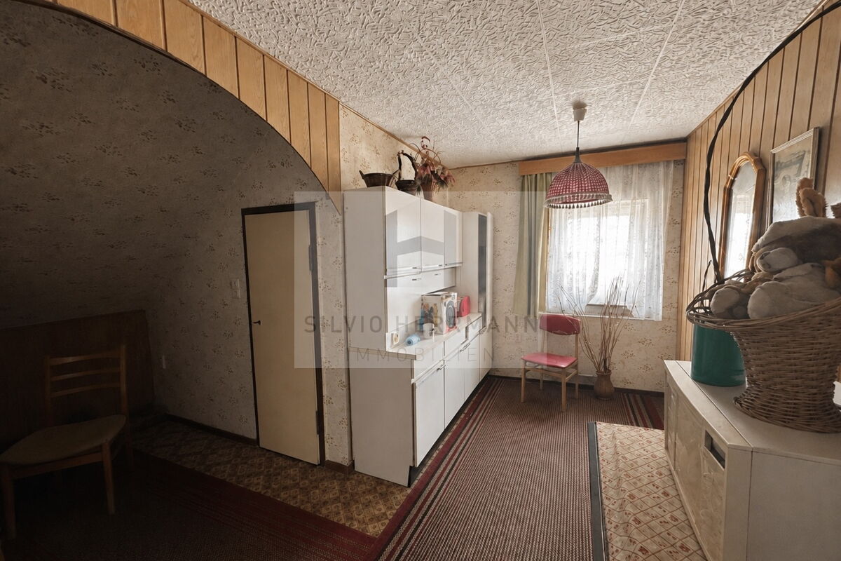 Dachgeschoss Zimmer mit Ofen